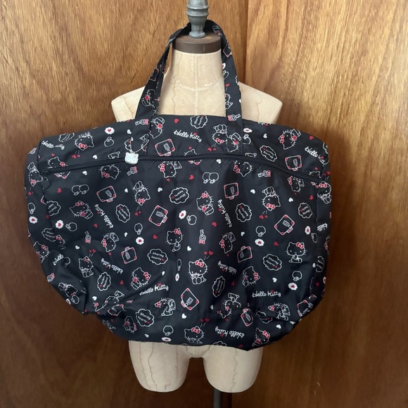 Sanrio Handbags - HELLO KITTY Black Foldable Travel Duffle Bag w/ Luggage Handle Sleeve